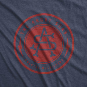 Product: "Bolt Badge" Tri-Blend T-Shirt // Description: Angry Seas tee with monogram in crimson silkscreened design // Color: Vintage Navy // Brand: The Angry Seas - Fishing Apparel