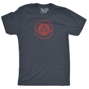 Product: "Bolt Badge" Tri-Blend T-Shirt // Description: Angry Seas tee with monogram in crimson silkscreened design // Color: Vintage Navy // Brand: The Angry Seas Clothing