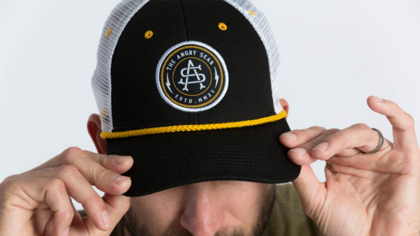 Product: "Captain's Hat" Snapback Hat // Description: Low Profile mesh snapback hat with embroidered monogram logo patch // Color: Black // Brand: The Angry Seas Clothing
