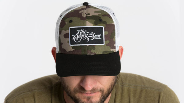 Product: "True Script" Snapback Hat // Description: Semi-Curved Bill mesh snapback hat with woven label appliqué // Color: Camo on White // Brand: The Angry Seas Clothing
