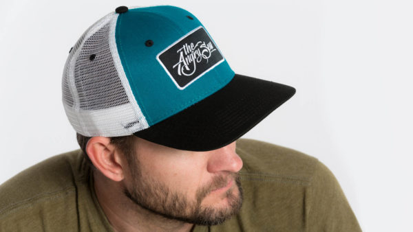 Product: "Ture Script" Snapback Hat // Description: Semi-Curved Bill mesh snapback hat with woven label appliqué // Color: Teal on White // Brand: The Angry Seas Clothing