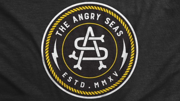 Product: "Captain's Mark" Tri-Blend T-Shirt // Description: Angry Seas tee with monogram badge silkscreened design // Color: Vintage Black // Brand: The Angry Seas Clothing