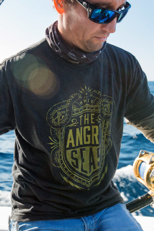 Product: "Electric Shield" Tri-Blend T-Shirt // Description: Angry Seas tee with electric eels and shield surrounded by lightning bolts silkscreened design // Color: Vintage Black // Brand: The Angry Seas Clothing