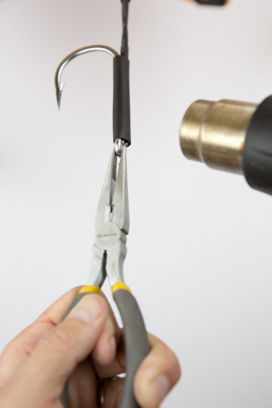 Use the heat shrink to protect the wire and hook assembly of the wahoo lure